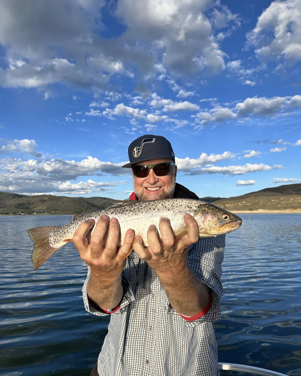 Jay Hunsaker, Hooked Reel Good fishing guide, holding a cutthroat trout on Strawberry Reservoir